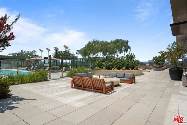 view of patio / terrace featuring a pool and outdoor lounge area