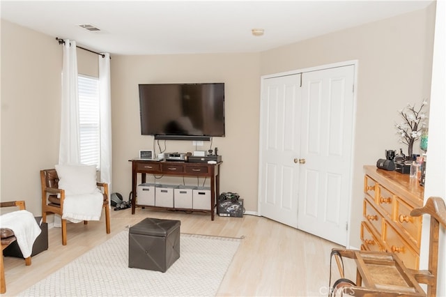 sitting room featuring light wood-type flooring