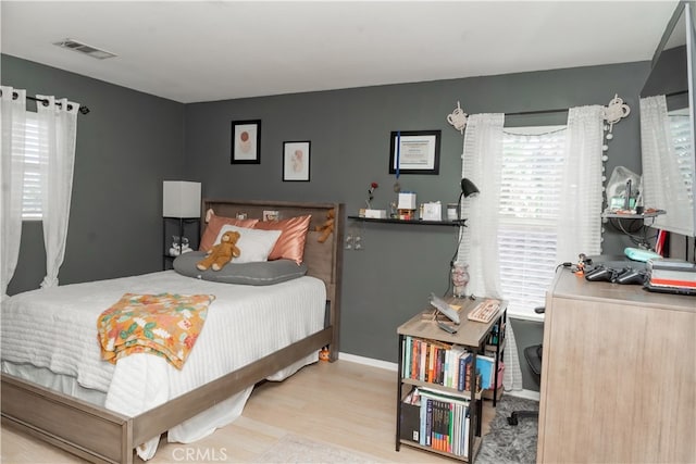 bedroom with light hardwood / wood-style flooring