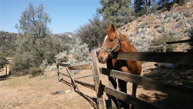 view of stable with a mountain view