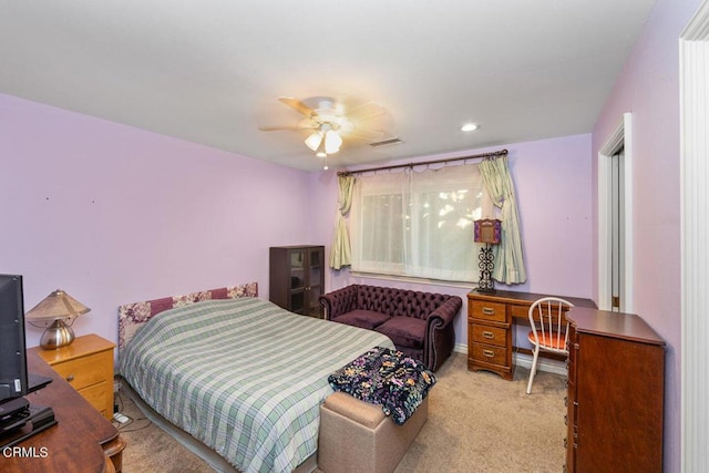 bedroom with ceiling fan and light colored carpet