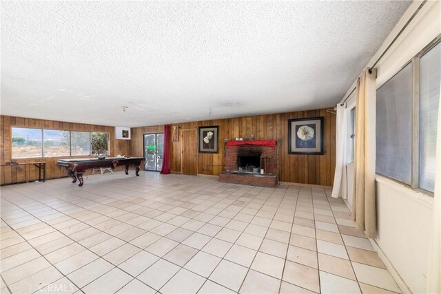 10925 Post Office Rd A/B, Unit A/B, Lucerne Valley, CA 92356 - game room featuring a textured ceiling, wood walls, pool table, and a brick fireplace