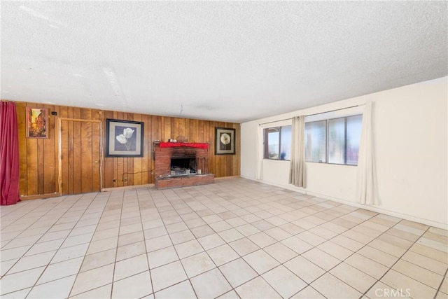 10925 Post Office Rd A/B, Unit A/B, Lucerne Valley, CA 92356 - unfurnished living room with a textured ceiling, wooden walls, and a brick fireplace