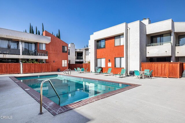 view of swimming pool featuring a patio area