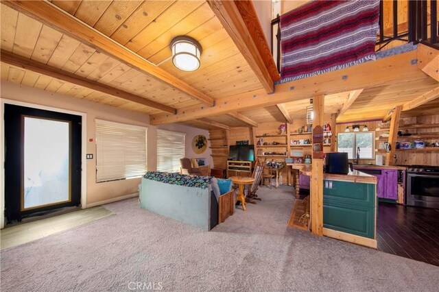 living room featuring wood ceiling, dark carpet, sink, and beamed ceiling