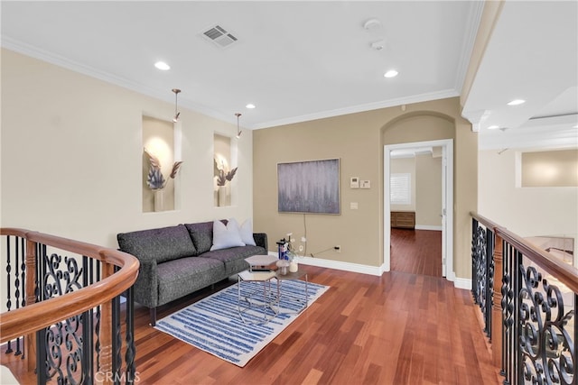 living room with ornamental molding and dark hardwood / wood-style flooring