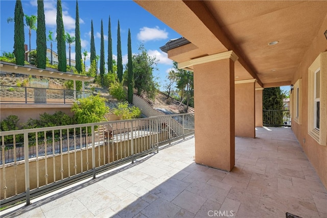 view of patio with a balcony