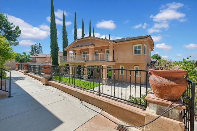 view of front of property with a balcony