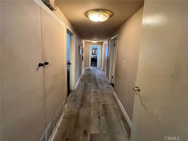 hallway featuring hardwood / wood-style flooring