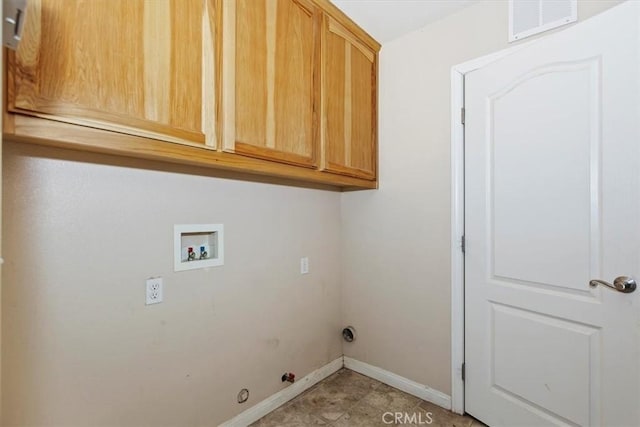 laundry room with hookup for a gas dryer, hookup for a washing machine, and cabinets