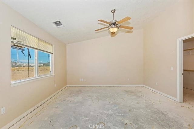 unfurnished room with ceiling fan