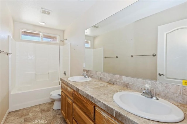 full bathroom with vanity,  shower combination, and toilet