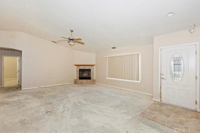 unfurnished living room with vaulted ceiling and ceiling fan