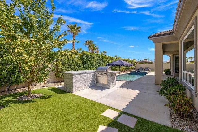 view of patio / terrace with a grill and an outdoor kitchen