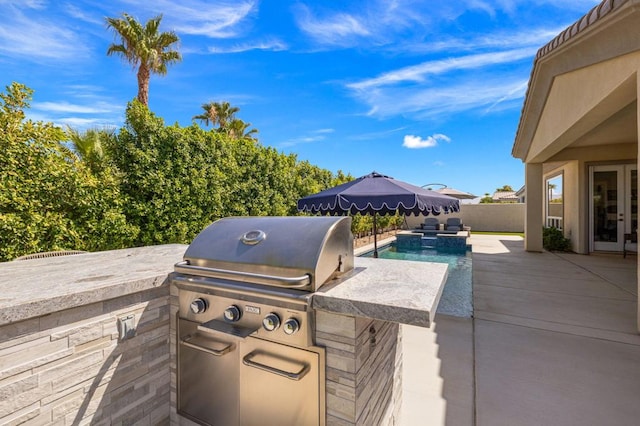 view of patio with an outdoor kitchen