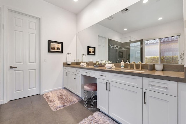 bathroom with vanity, concrete flooring, and walk in shower