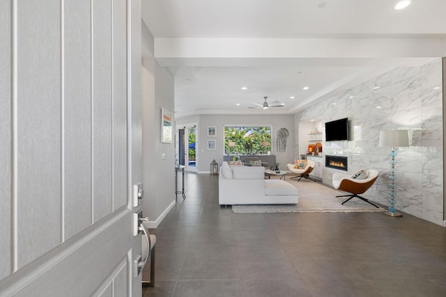 unfurnished living room with ceiling fan