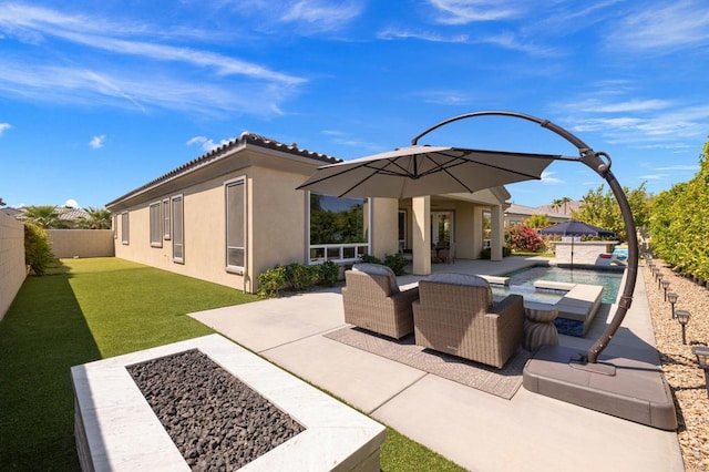 view of patio featuring a swimming pool with hot tub