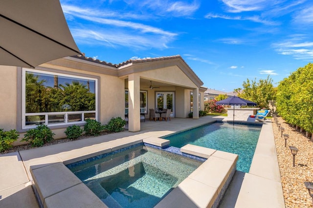 view of pool featuring an in ground hot tub, ceiling fan, and a patio