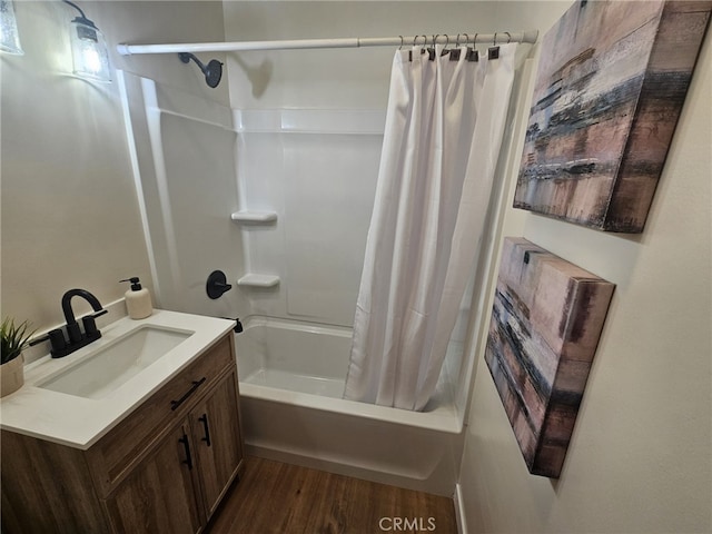 bathroom with vanity, hardwood / wood-style flooring, and shower / tub combo