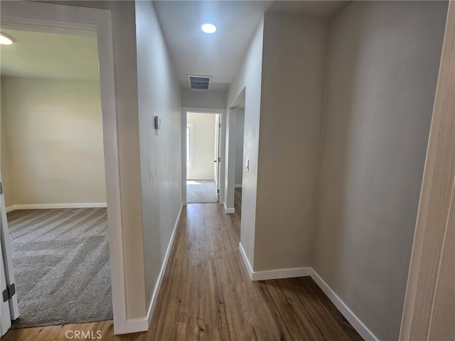 hallway featuring hardwood / wood-style flooring