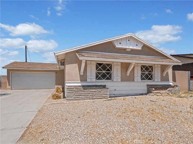 view of front of property featuring a garage and covered porch