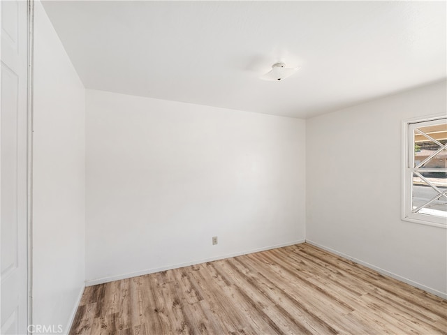 unfurnished room with light hardwood / wood-style flooring