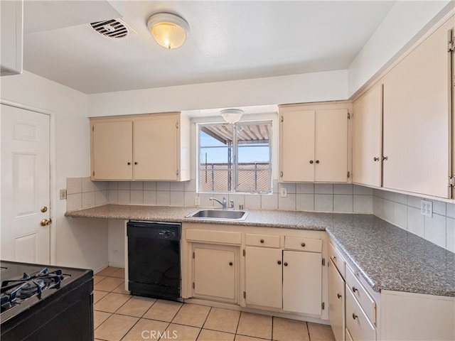 kitchen with black appliances, decorative backsplash, sink, and cream cabinetry