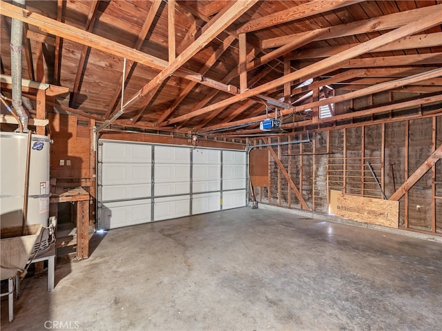 garage featuring a garage door opener and water heater