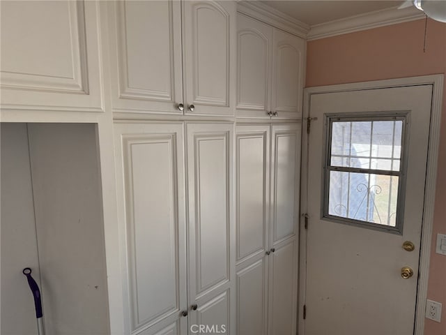 interior space with crown molding