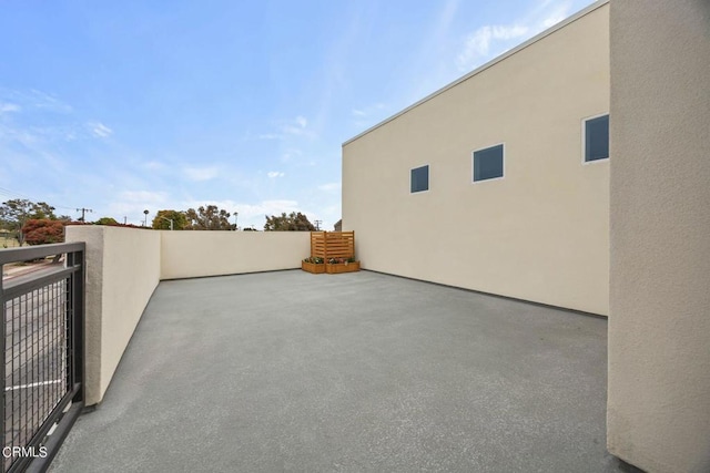 view of patio featuring a balcony and central air condition unit