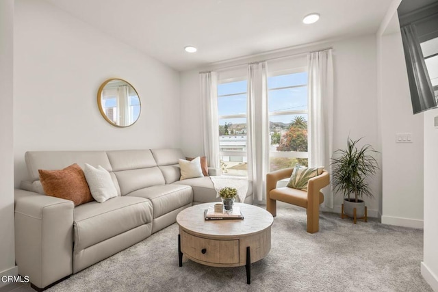 living room featuring baseboards, carpet floors, and recessed lighting