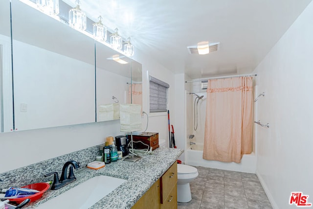 full bathroom featuring tile patterned floors, shower / bath combination with curtain, toilet, and vanity