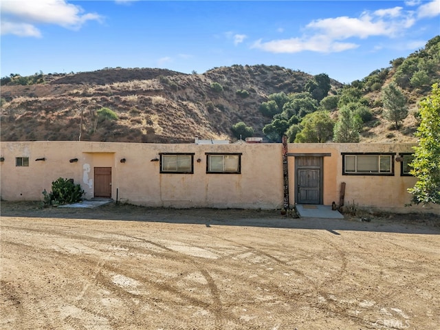 adobe home with a mountain view