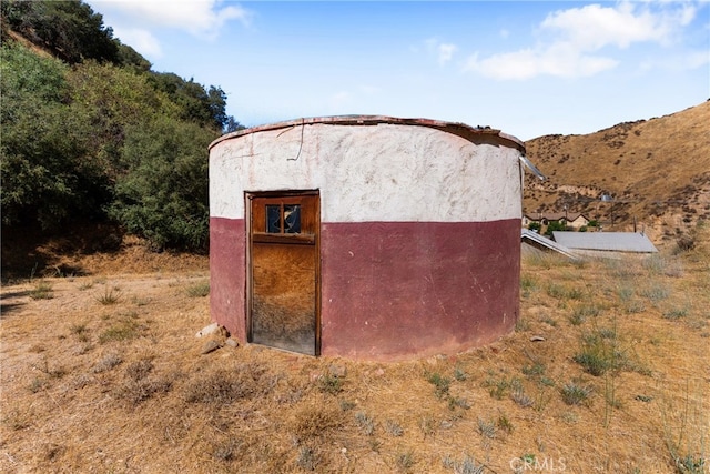 view of outdoor structure with a mountain view