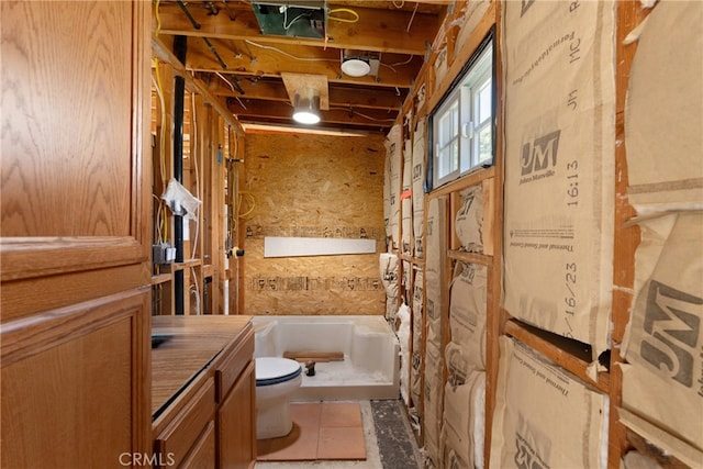 full bathroom with shower / bathtub combination with curtain, vanity, and toilet