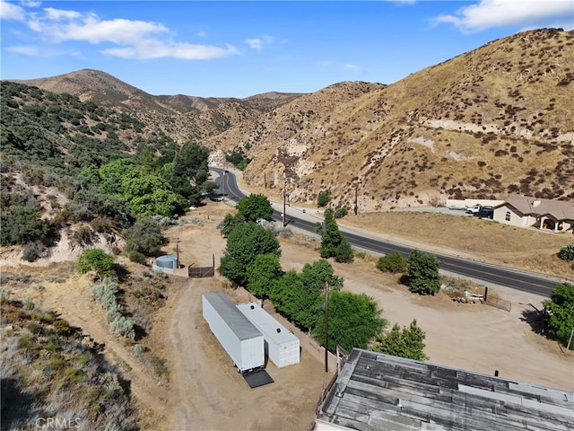 birds eye view of property with a mountain view