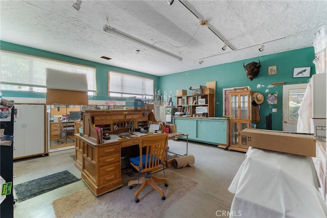 office with a textured ceiling