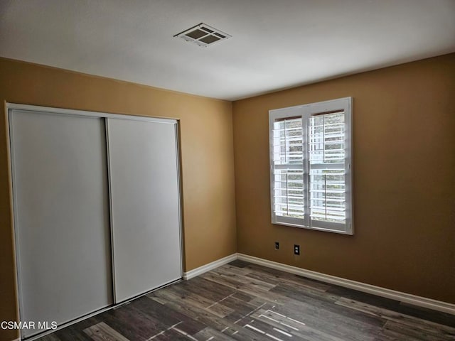 empty room featuring dark hardwood / wood-style floors