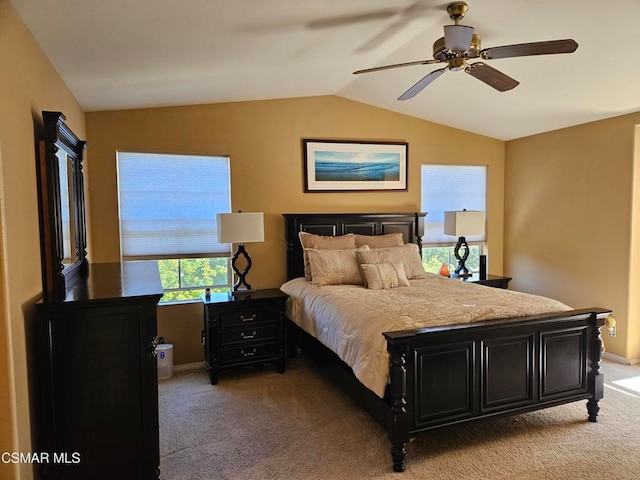 carpeted bedroom featuring vaulted ceiling and ceiling fan