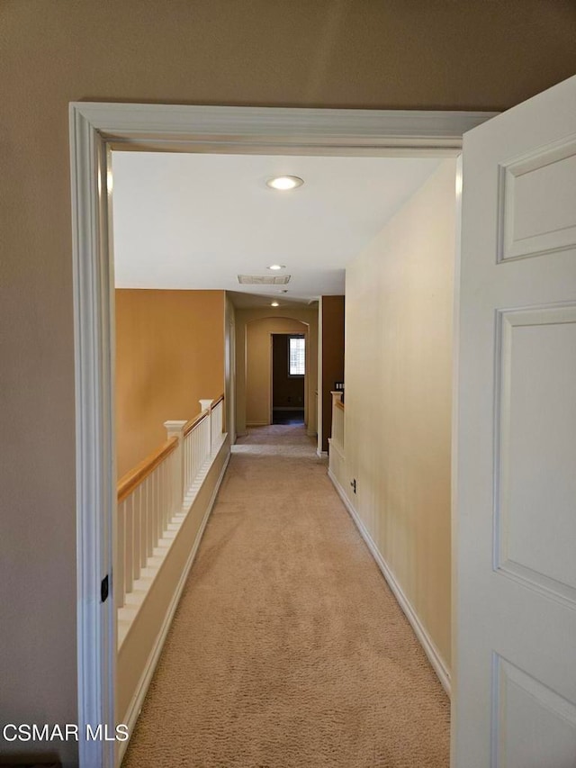 corridor with light carpet