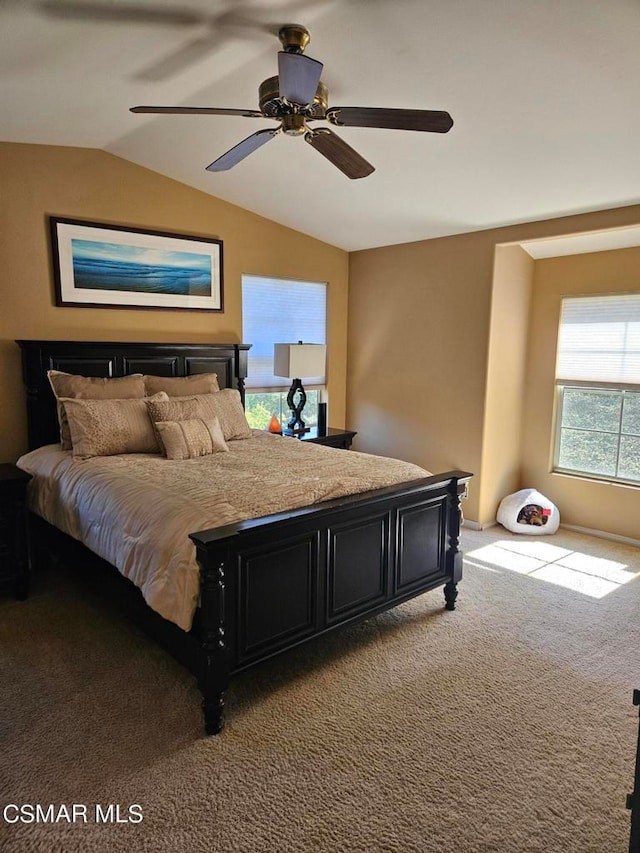 carpeted bedroom featuring lofted ceiling and ceiling fan