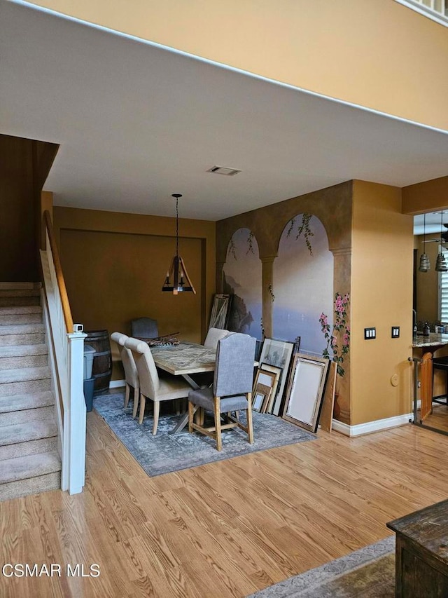 dining space featuring light wood-type flooring