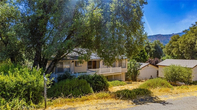 view of front of home with a mountain view