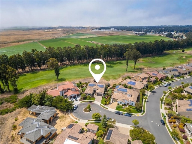 drone / aerial view featuring a residential view and view of golf course