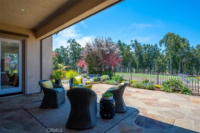 view of patio / terrace featuring fence