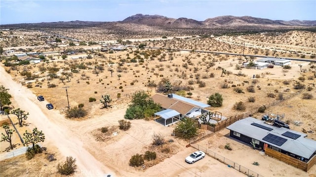 aerial view featuring a mountain view, a desert view, and a rural view
