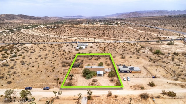 birds eye view of property featuring a mountain view