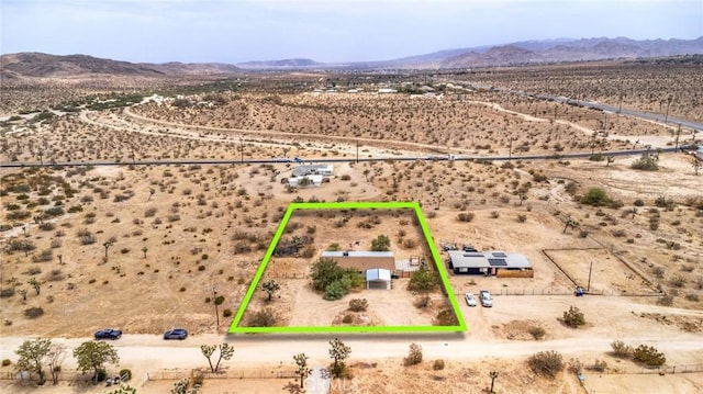 drone / aerial view with a rural view, a desert view, and a mountain view