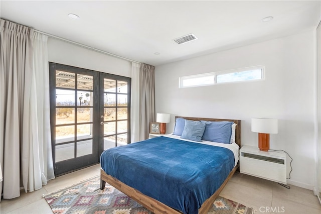 tiled bedroom with french doors and multiple windows